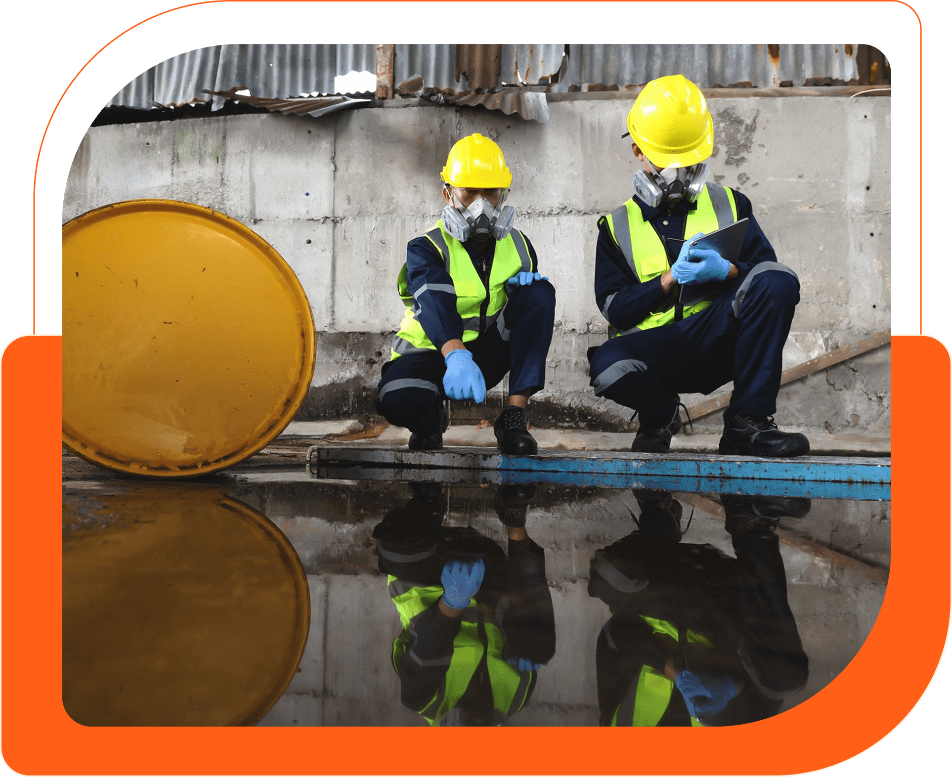 Workers in safety gear inspecting spill.
