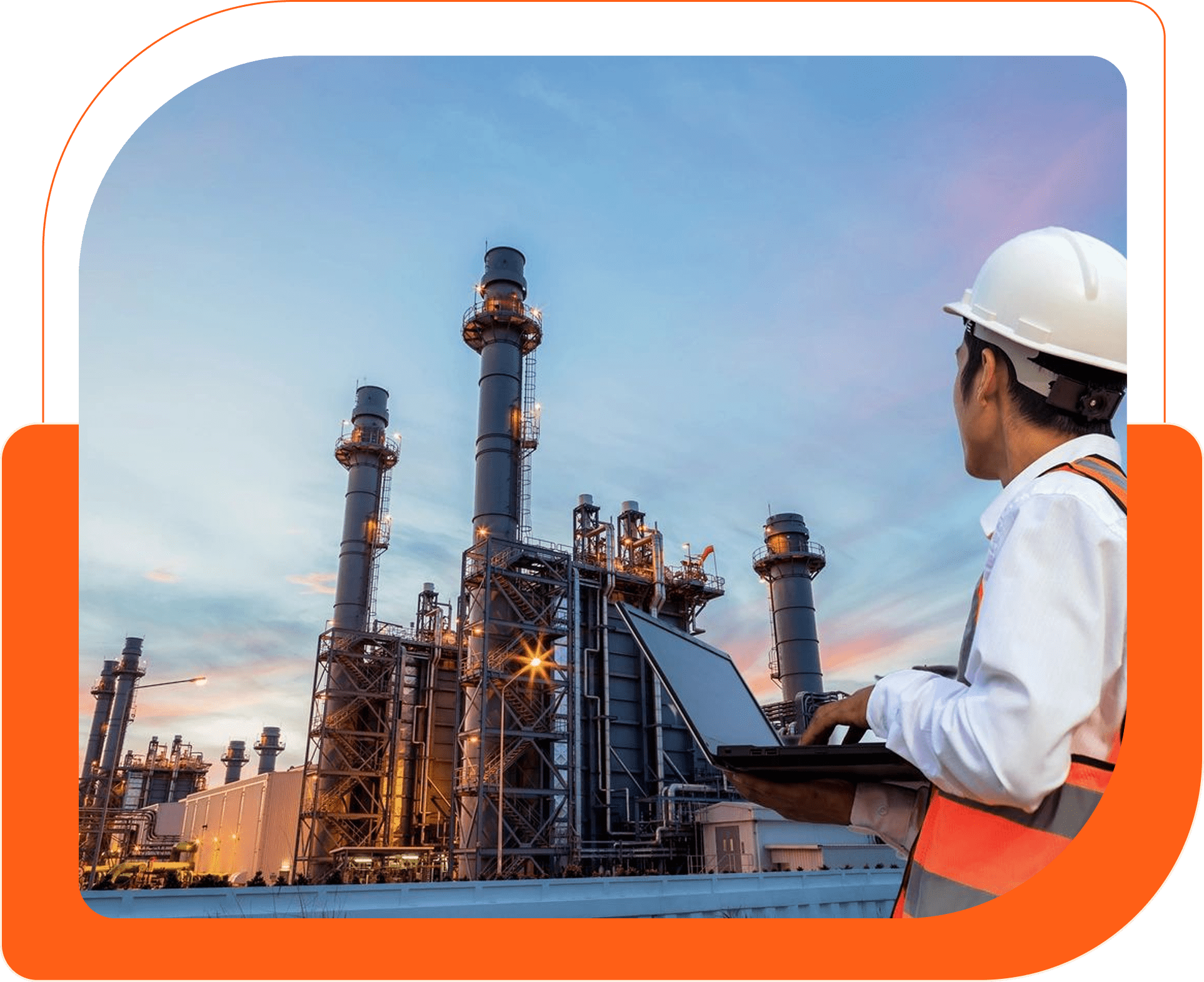 Engineer inspecting industrial plant at sunset.