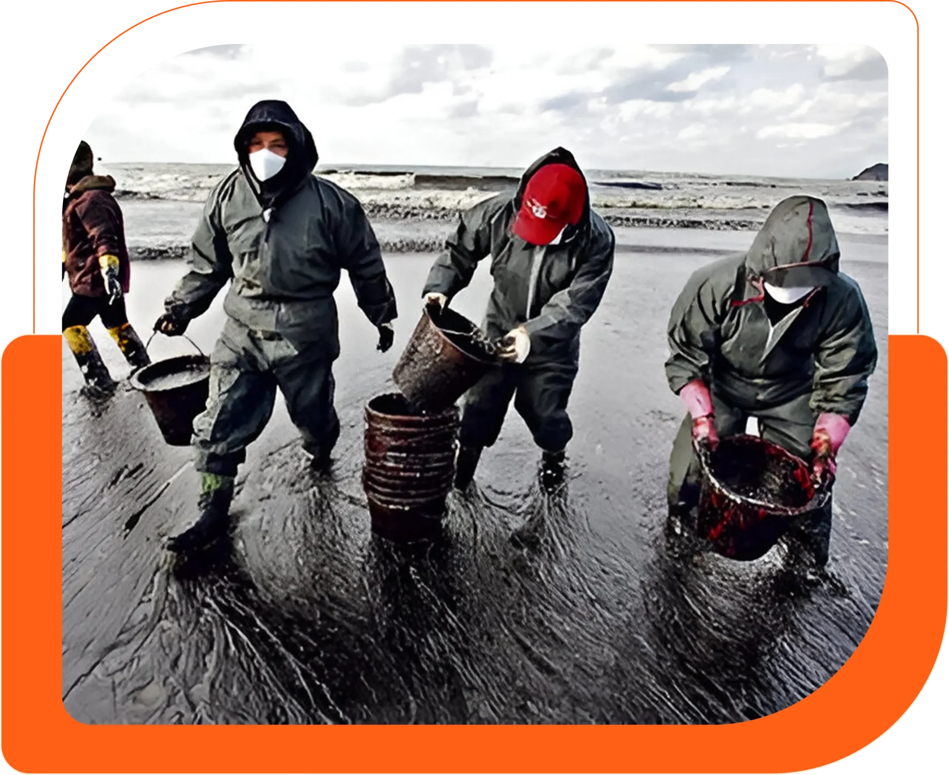 Workers cleaning oil spill on beach.